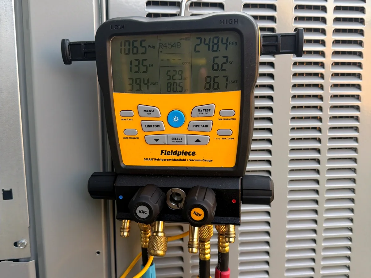 Refrigerant gauges connected for HVAC system diagnostics