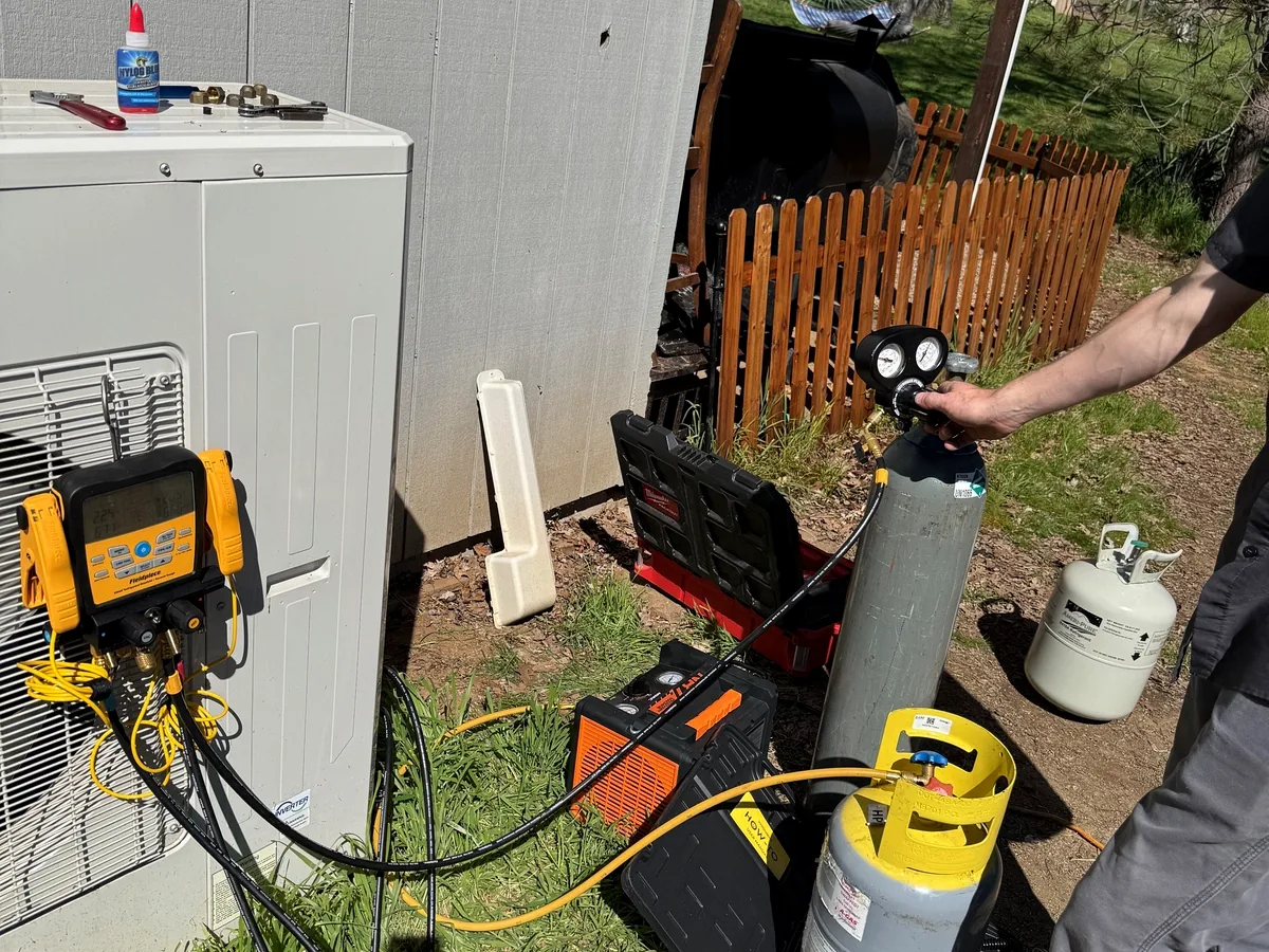HVAC technician servicing residential equipment
