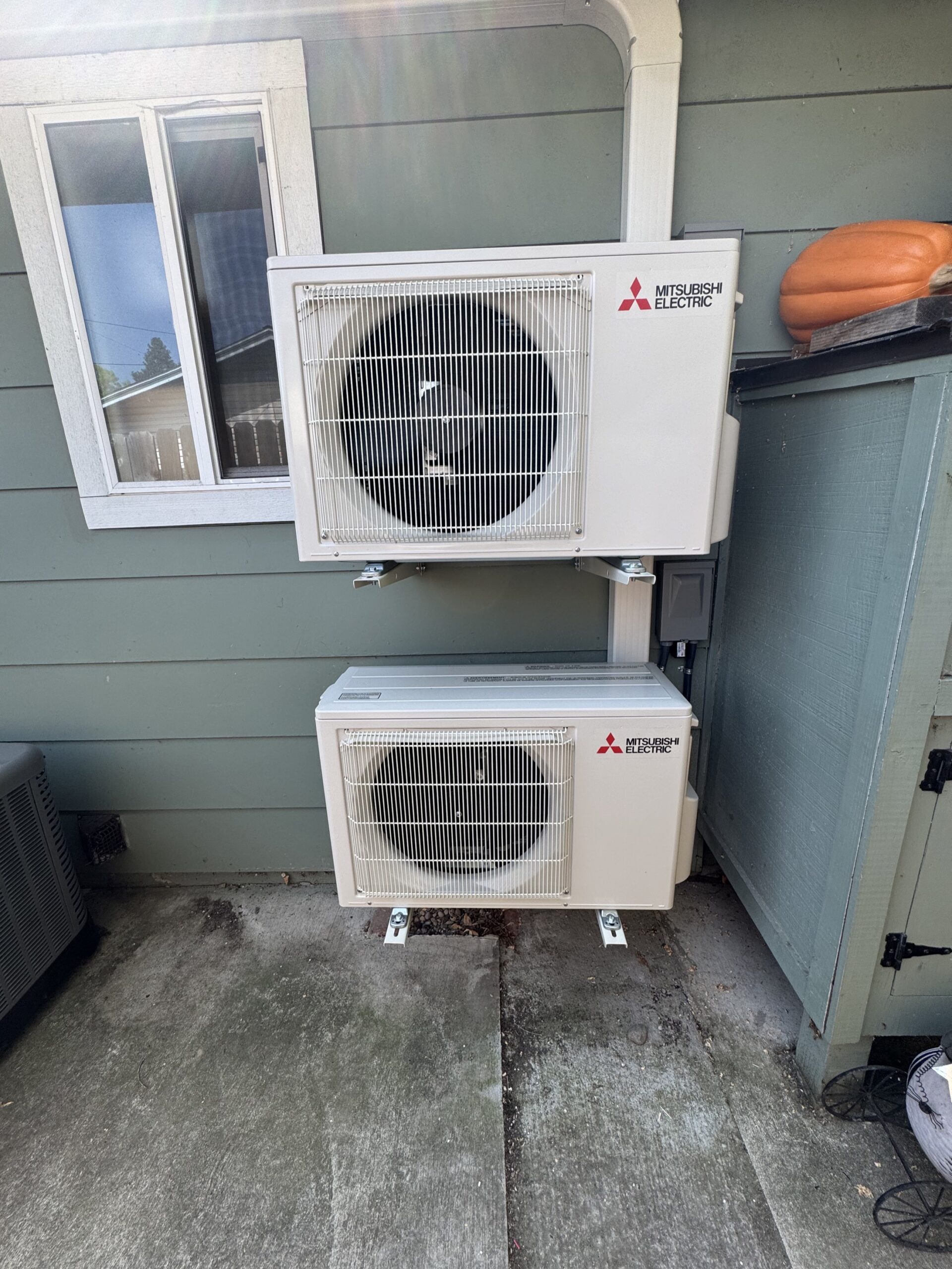 Outdoor HVAC equipment installed beside a home